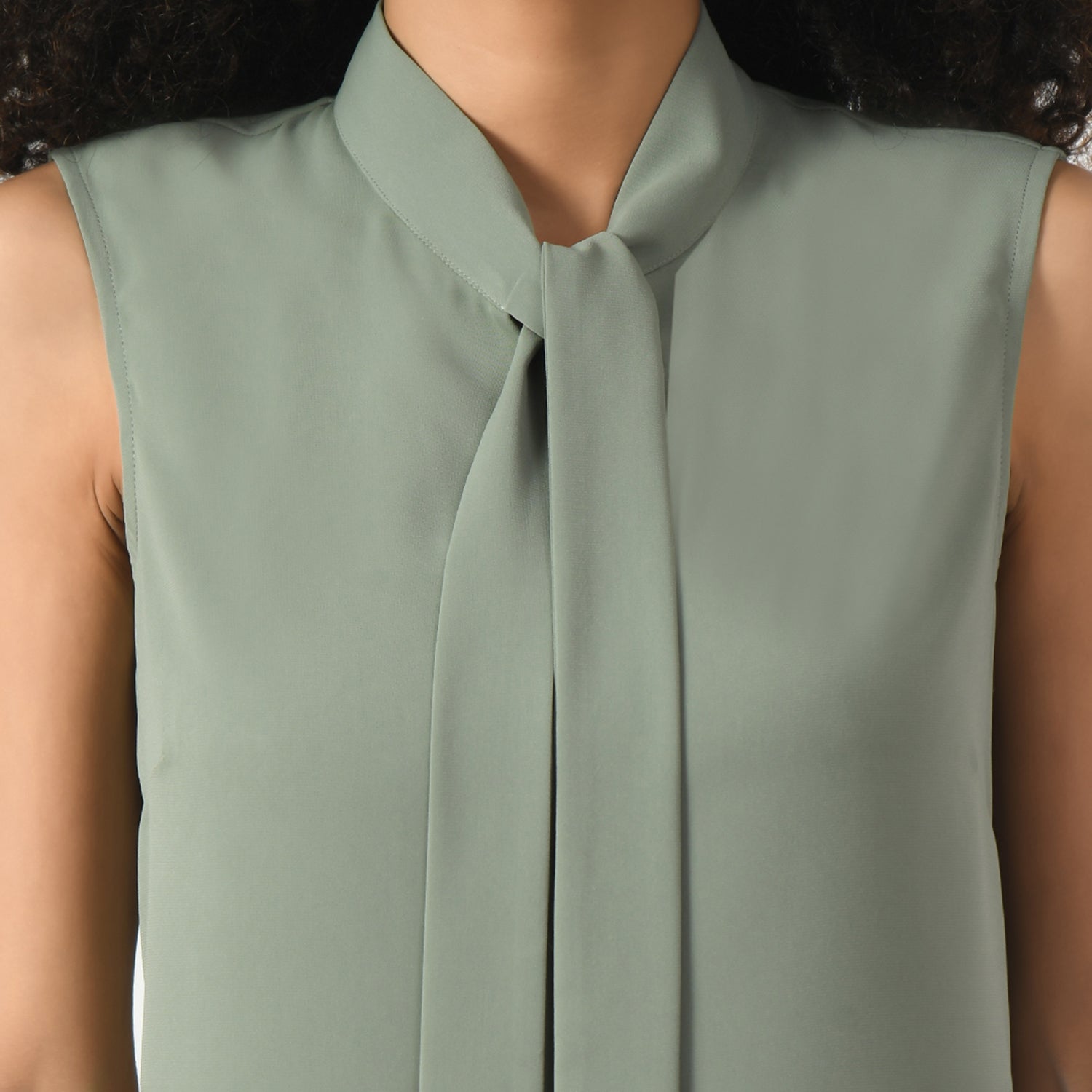Dusty Green Sleeveless Top With Knot, sleeveless top, top with the knot, green tops for women, tops with knots for women, office wear tops , stylish formal tops , best tops for work, stylish work tops , trendy tops for women ,modern tops for office, formal tops for women, tops for women stylish