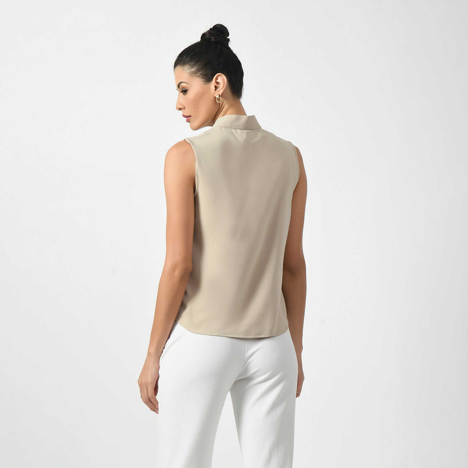 Light Beige Sleeveless Top With Knot, office wear tops , stylish formal tops , best tops for work, stylish work tops , trendy tops for women ,modern tops for office, formal tops for women, tops for women stylish, top with knots, sleveless top