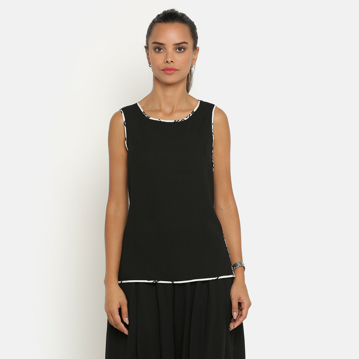 Black sleeveless top with contrast piping