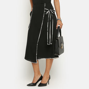 Black asymmetrical skirt with contrast piping