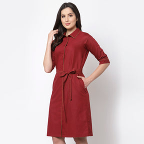 Red dress with belt and brown piping