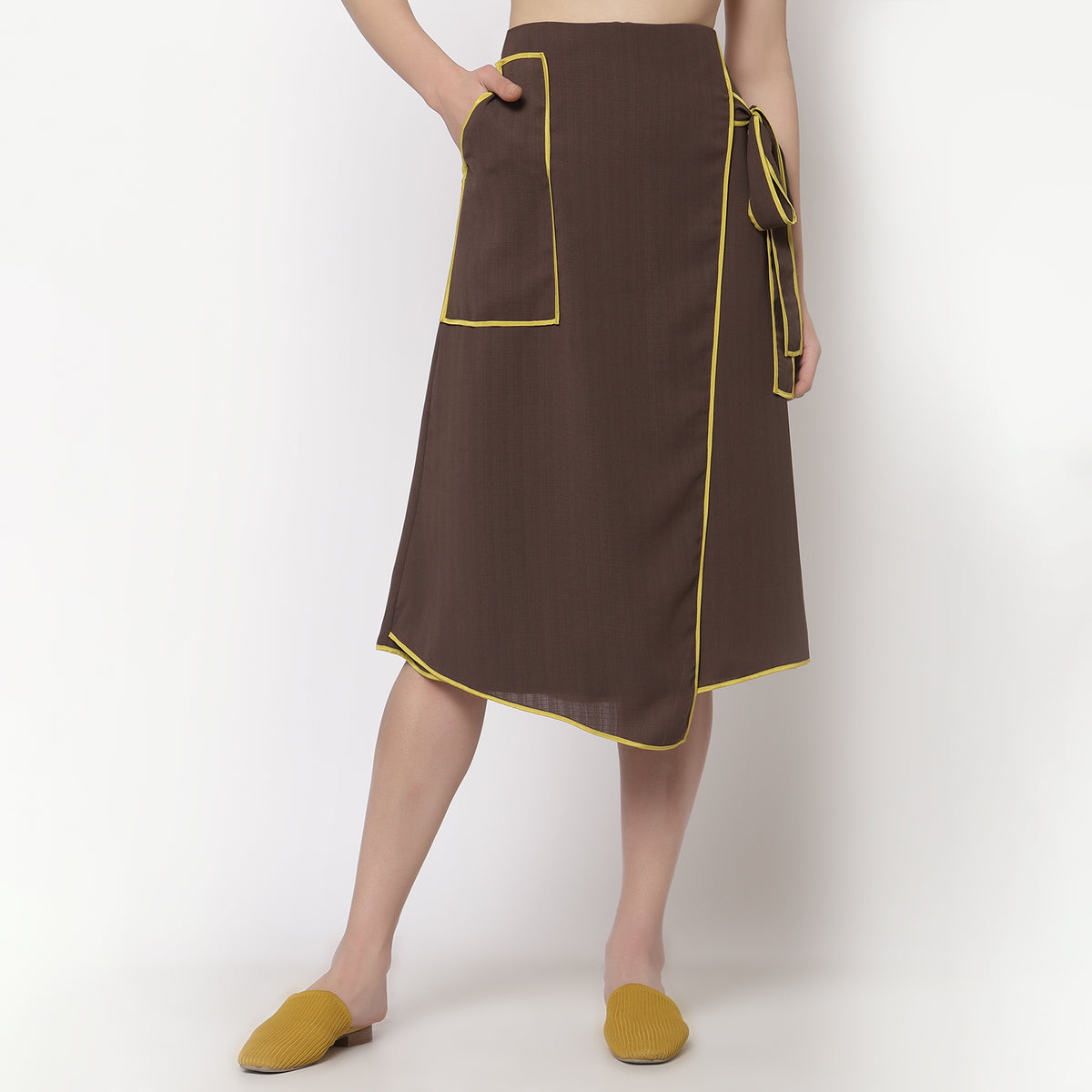 Brown asymetrical skirt with yellow piping